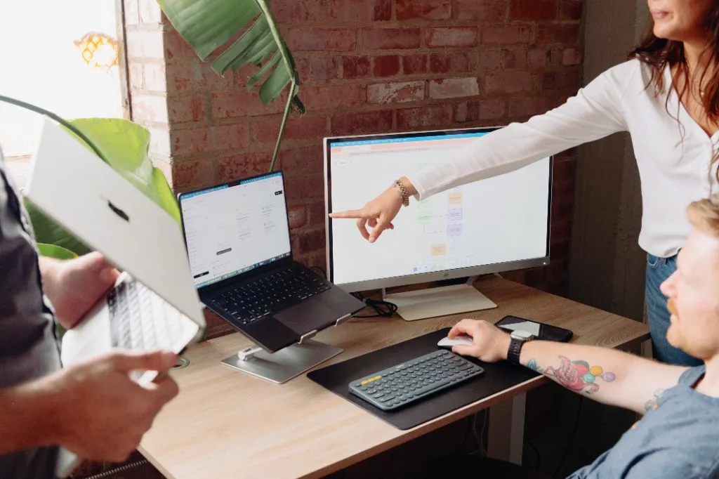 918 Studio team reviewing product work at a desk